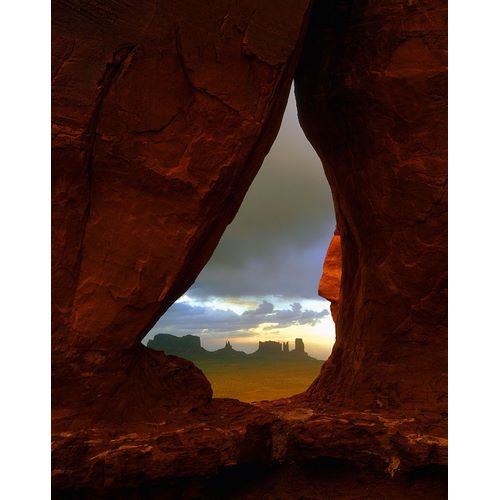 Teardrop arch frames the Monument Valley rock formations on the Utah-Arizona border